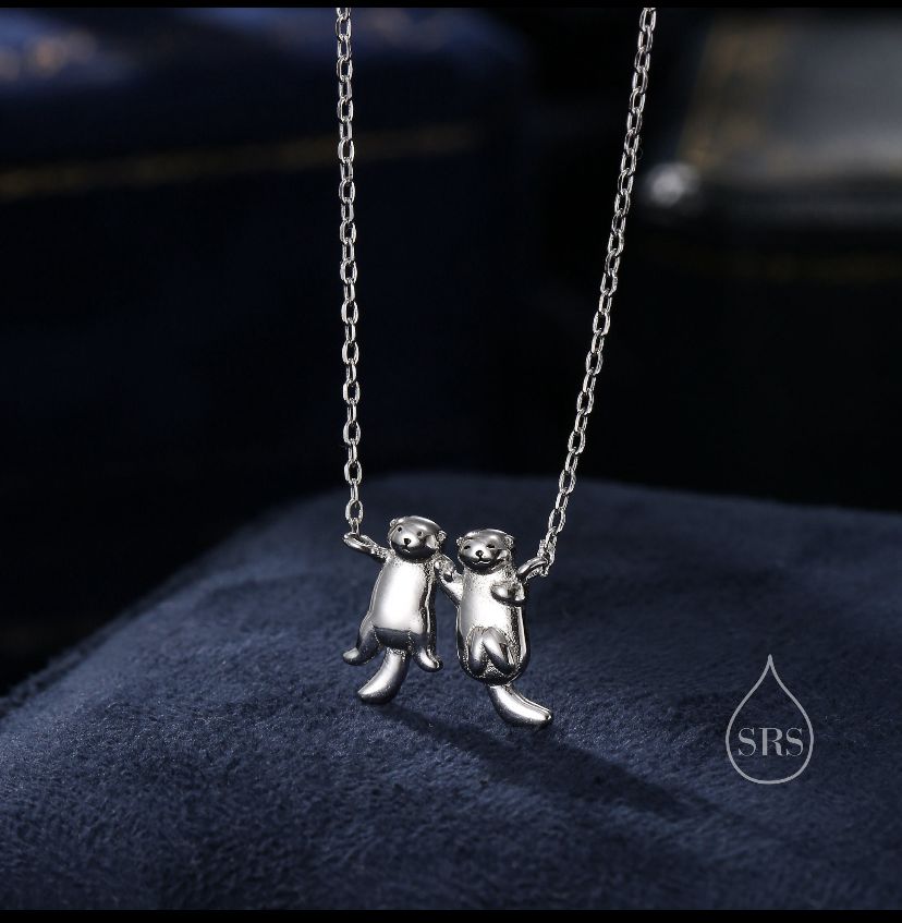 Otters Holding Hands Necklace